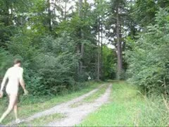 A naked guy dilettante strolling in the bush while dressed in natural attire